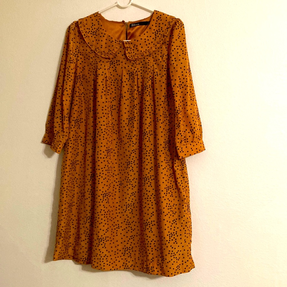 L size dress, satin I think. warm caramel with ruffle neck, half sleeves.